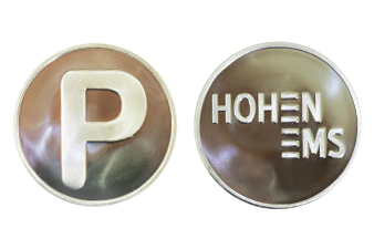 Vorder- und Rückansicht der Parkmünzen Hohenems